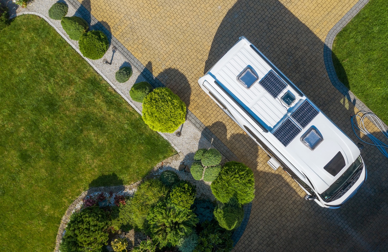 rv parked outside home in residential driveway